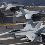 1920px-US_Navy_101209-N-9693M-009_Two_F-A-18E_Super_Hornets_prepare_for_a_catapult_assisted_launch_a.jpeg