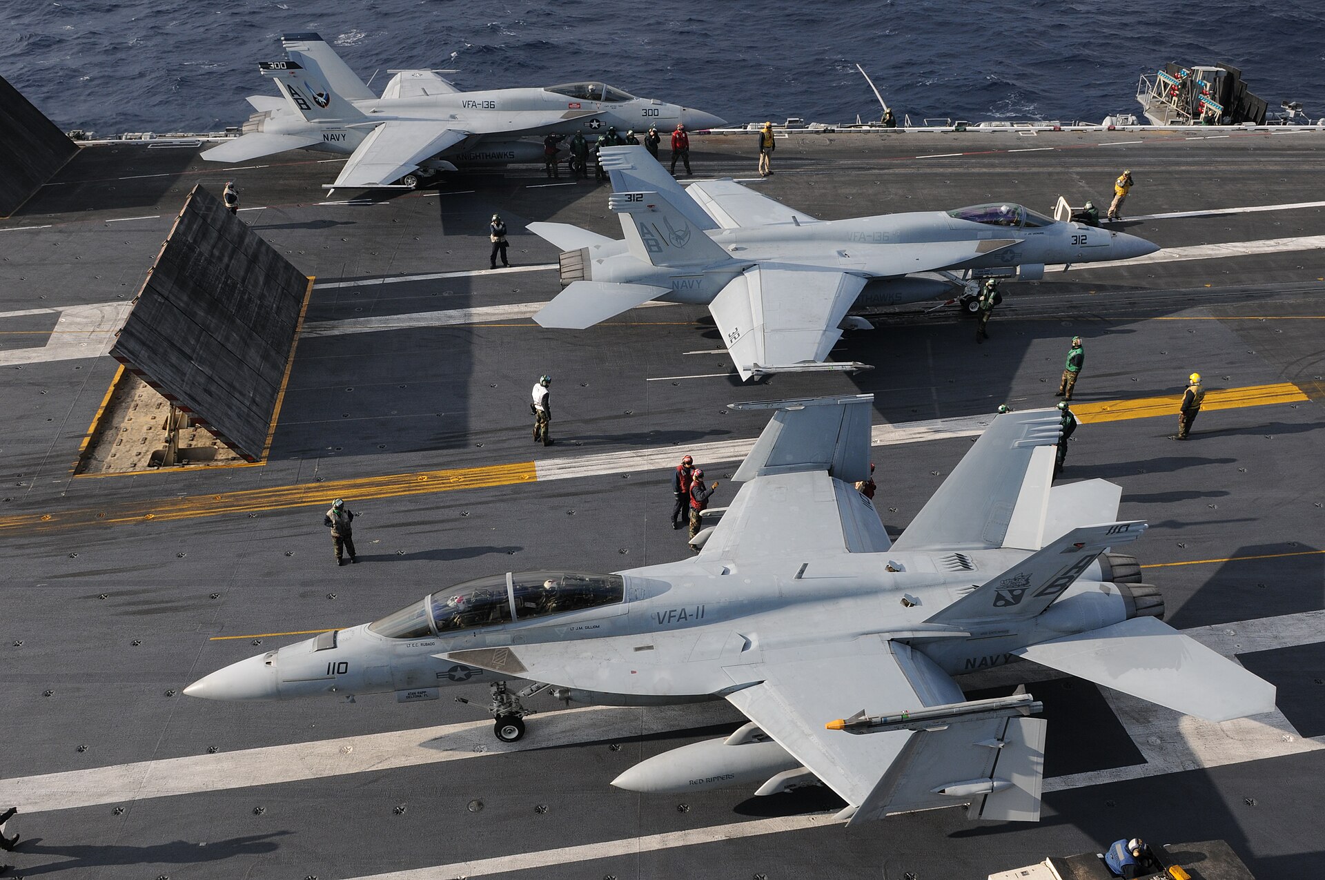 1920px-US_Navy_101209-N-9693M-009_Two_F-A-18E_Super_Hornets_prepare_for_a_catapult_assisted_launch_a.jpeg