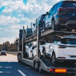 car-transport-truck-driving-on-highway-road-car-c-2024-09-23-16-39-30-utc.jpg