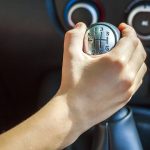 driver-hand-shifting-gear-shift-knob-manually-sel-2023-11-27-05-06-45-utc.jpg