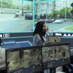 indian-woman-team-leader-guides-her-staff-monitor-surveillance-footage-scaled-e1777894954670.jpg