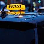 twilight-taxi-service-in-city-center-during-rush-h-2025-03-16-19-38-46-utc.jpg