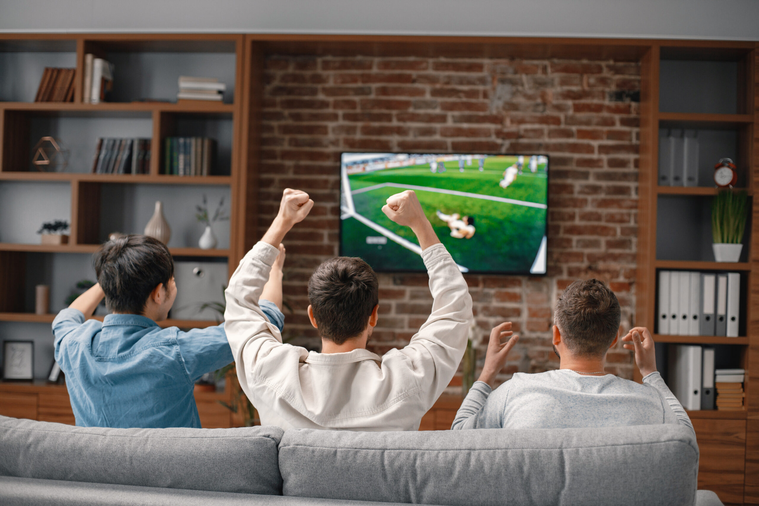 back-view-of-men-watching-a-football-game-on-tv-an-2026-03-16-00-35-31-utc-scaled.jpg
